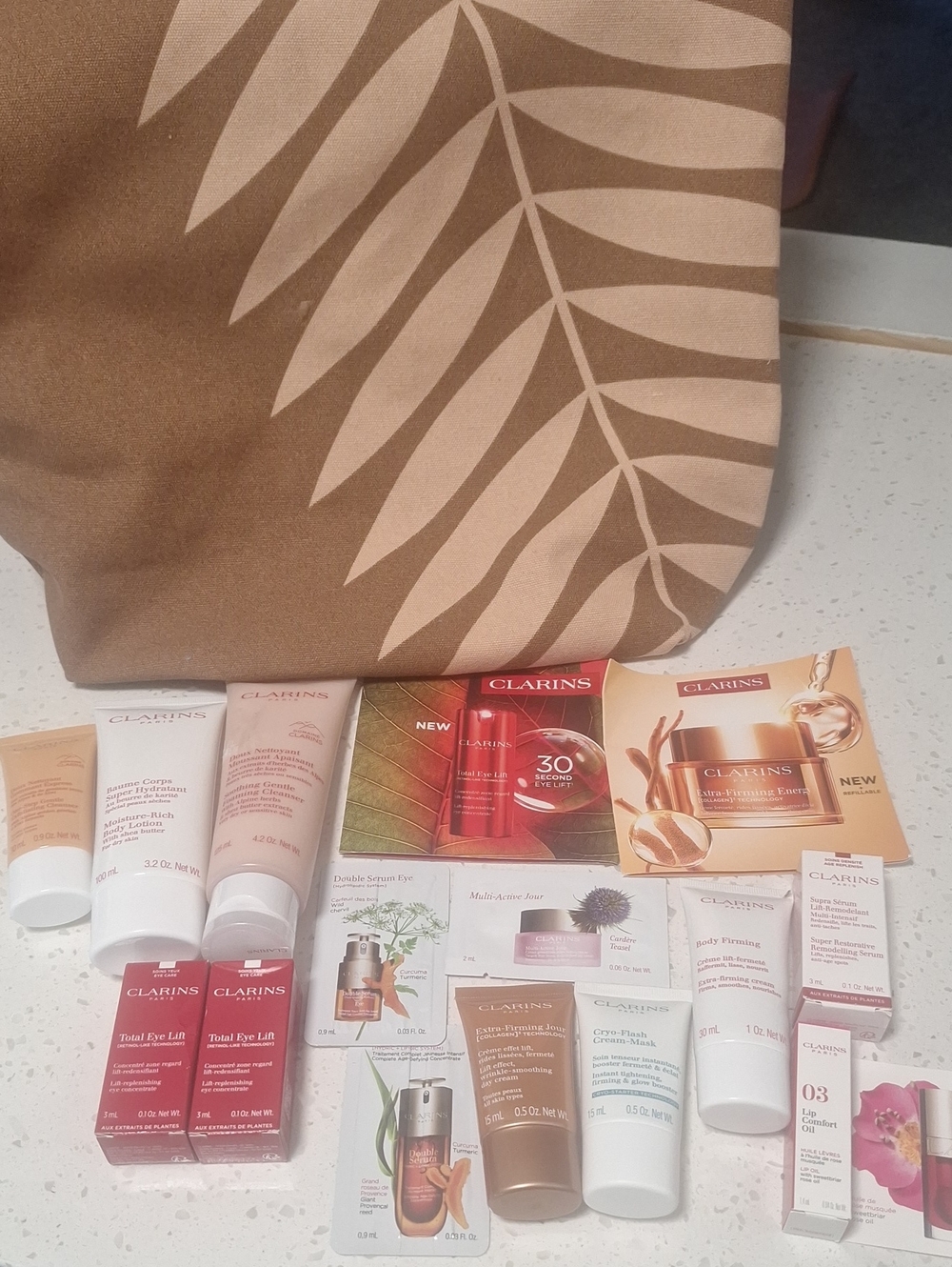 Clarins Beige and Cream Leaf-Print Tote with Skincare Samples